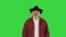 Adult smiling man in black cowboy hat walking on a Green Screen, Chroma Key.