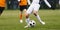 Adult Soccer Player Kicking Ball on game