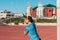 Adult sport man practicing trx in a calisthenics park, working the strength of the muscles of the arms and back outdoors. Healthy