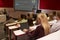 Adult student using laptop computer at a university lecture