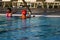 Adult teaching child to swim