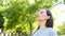 Adult woman breathing fresh air in a park