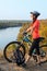 Adult woman cyclist admiring the landscape.