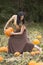 Adult woman dancing in a Connecticut pumpkin patch in autumn