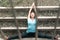 Adult woman does sports exercise. Yoga teacher doing an asana