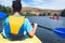 Adult woman doing a canoe air water sport as healthy lifestyle