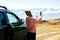 Adult woman enjoy taking photo with mobile phone to the nature in the mountain