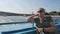 Adult woman enjoying tourist boat trip along the river