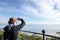 Adult woman enjoys the view after climbing the top of Hunting Island Lighthouse