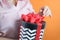 Adult woman holds box with gift, concept of love, tender relationship of couple in love, birthday, valentine`s day, mother, merry