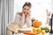 Adult woman in the kitchen preparing pumpkin dishes for Halloween