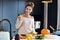 Adult woman in the kitchen preparing pumpkin dishes for Halloween