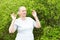 Adult woman meditates outdoors.