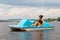 Adult woman on a pedal boat alone