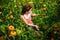 Adult woman picking tomatoes in the garden. Women in greenhouse.