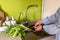 Adult woman washing carrot kitchen sink vegetarian food