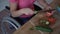 Adult woman in wheelchair cutting tomato for salad on her kitche