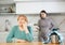 Adult woman and young woman during quarrel in kitchen