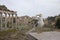 An adult yellow-legged gull photographed with a wide angle in front of the plaza of the Roman Forum.