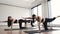 Adult yogis using Balancing Table Pose during yoga workout