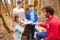 Adults And Children Examining Animal Horn At Activity Centre