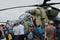 Adults and children watch mi-24 helicopter