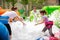 Adults collecting balls in inflatable pool with foam