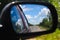 Advance travelling on rural roads. car riding. rear-view mirror