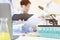 Advanced equipments on the table with blurred background of a group of scientist having the meeting