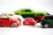 Advantages of small cars with multiple toy cars on white background