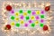 Advent calander parer notes, with a border of golden star christmas lights and red baubles
