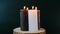 advent candle. Christmas advent four candles. Four burning wax candles on a wooden cut on dark green background.Rotation