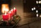 Advent candles with Christmas tree and burning chimney fire