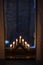 advent candlestick on window sill at night