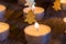 Advent or Christmas candlelights with ornaments on wood