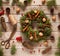 Advent Christmas wreath decoration with natural decorations, pine cones spruce, nuts, candied fruit on wooden background
