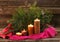 Advent four burning candle and christmas decoration with cross