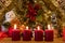 Advent theme with 4 burning red candles and Christmas decoration