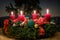 Advent wreath with four lighted red candles