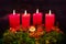 Advent wreath with four red candles and gnome