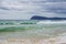 Adventure Bay beach Bruny Island with dramatic headland in background