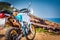 Adventure bike on a dirt road by the sea