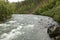 Adventure canoeing rapids on an Alaskan river