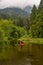 Adventure Caucasian Adult Woman Kayaking in Red Kayak