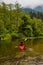 Adventure Caucasian Adult Woman Kayaking in Red Kayak