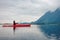 Adventure Caucasian Adult Woman Kayaking in Red Kayak