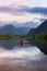 Adventure Caucasian Adult Woman Kayaking in Red Kayak