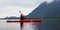 Adventure Caucasian Adult Woman Kayaking in Red Kayak