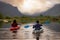 Adventure Friends Kayaking in Kayak surrounded by Canadian Mountain Landscape