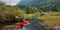 Adventure Friends Kayaking in Kayak surrounded by Canadian Mountain Landscape